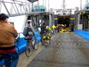 bicyclists walking down gangplank